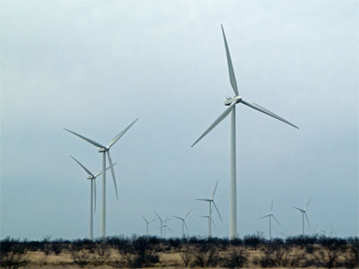 Modern windmills have replaced oil derricks north of Abilene.