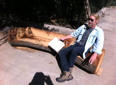 Arborilogical wonder Steve Houser smiles his “Seal of Agrooval” upon testing the log bench.