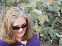 An inquisitive Gretchen checks out the prickly pear pads near Thurber.