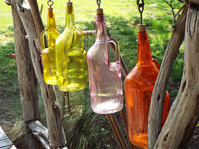 Colorful bottles bring a sparkle of color to a rustic bridge. Photos by Steven Chamblee.