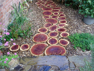A walkway of red cedar “cookies.”