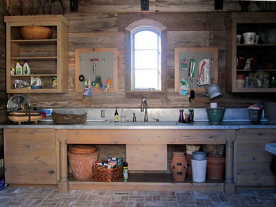 Inside the pigeonnier potting shed, a large zinc sink and ample cupboards stand ready for all kinds of potting and gardening chores.