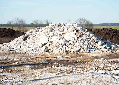 Houston black clay loam runs all along the I-35 corridor. Only a foot or two down, crews here near the McKinney airport have run into white caliche bedrock.