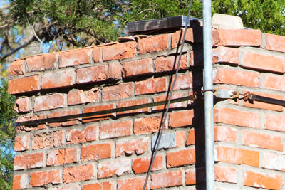 Photo: Chimney bricks, as I photographed them in our own chimney this week, are failing due to 38 years of exposure to rain/freezing/thawing. I should have known better.